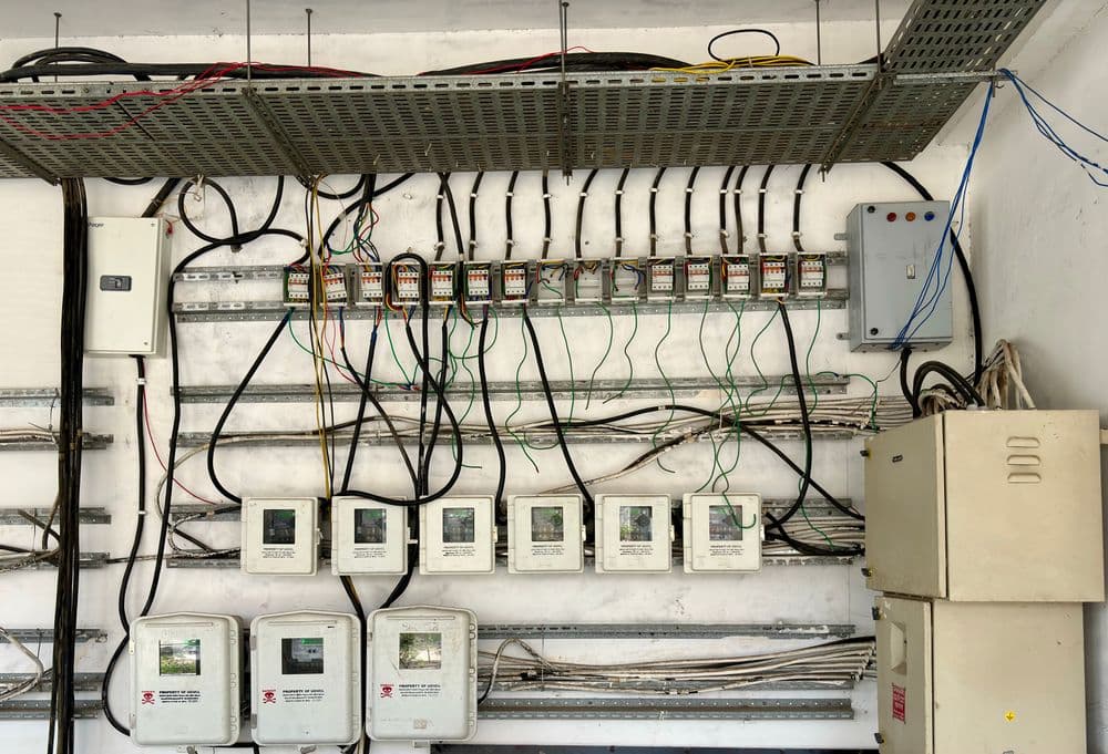 Electrical wiring and distribution boxes on a wall